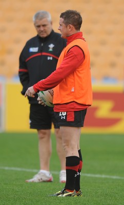 18.10.11 - Wales Rugby Training - Shane Williams during training as head coach Warren Gatland looks on. 