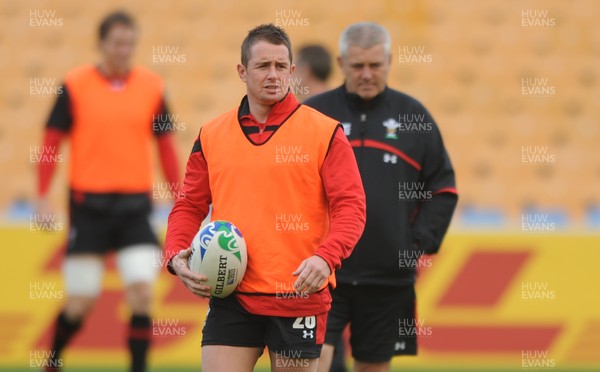 18.10.11 - Wales Rugby Training - Shane Williams during training as head coach Warren Gatland looks on. 