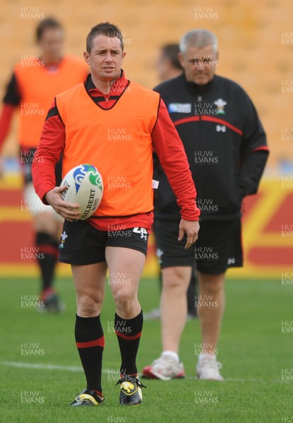 18.10.11 - Wales Rugby Training - Shane Williams during training as head coach Warren Gatland looks on. 