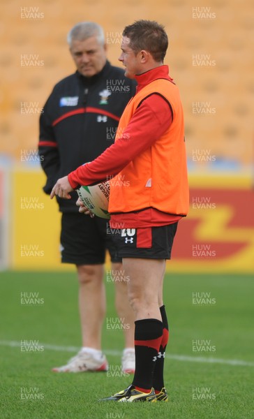 18.10.11 - Wales Rugby Training - Shane Williams during training as head coach Warren Gatland looks on. 