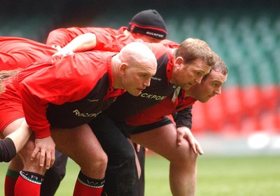 190203 - Wales Rugby Training - New Welsh captain Jonathan Humphreys (centre) at training packs down with Ben Evans (lt) and Iestyn Thomas (rt)