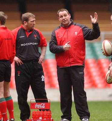 190203 - Wales Rugby Training - New Welsh captain Jonathan Humphreys discusses tactics at training with coach Steve Hansen (rt)