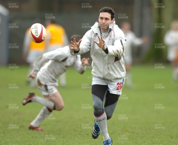 190207 - Wales Rugby Training - Stephen Jones takes a pass during training 