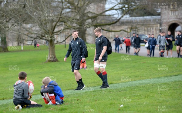 190219 - Wales Rugby Training - George North and Aaron Wainwright walk past young fans during training