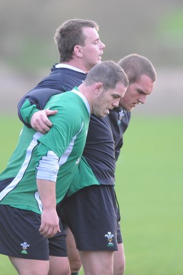 19.11.09 - Wales Rugby Training - Paul James, Matthew Rees and Gethin Jenkins pack down during training. 