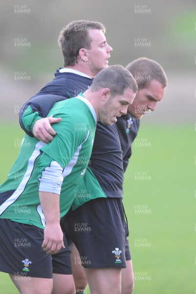 19.11.09 - Wales Rugby Training - Paul James, Matthew Rees and Gethin Jenkins pack down during training. 