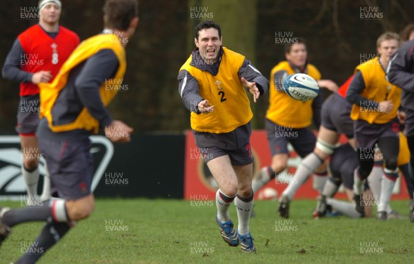 200207 - Wales Rugby Training - Stephen Jones gets the backs moving during training 