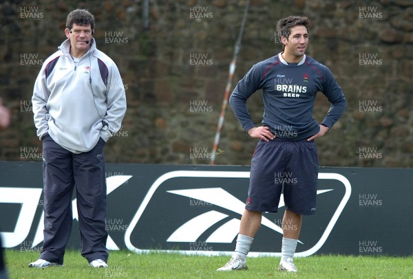 200207 - Wales Rugby Training - Wales Coach, Gareth Jenkins(L) looks on with Gavin Henson during training 