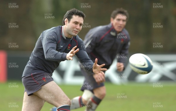 200207 - Wales Rugby Training - Stephen Jones takes a pass as James Hook supports during training 