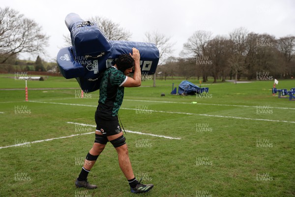 200224 - Wales Rugby Training in the week leading up to their 6 Nations game against Ireland - Dafydd Jenkins carries a pad during training