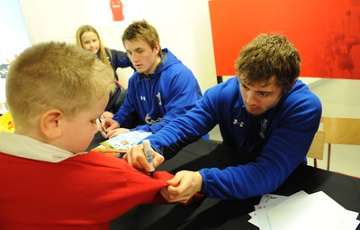 21.02.11 - Wales Rugby Training - Jonathan Davies and Leigh Halfpenny sign autographs at a Wales rugby training session which was opened up to the public at the Millennium Stadium. 