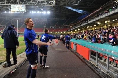 21.02.11 - Wales Rugby Training - Bradley Davies and Morgan Stoddart throw signed rugby balls into the crowd at a Wales rugby training session which was opened up to the public at the Millennium Stadium. 