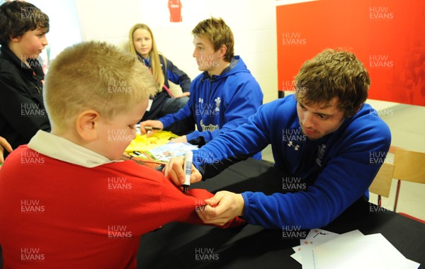21.02.11 - Wales Rugby Training - Jonathan Davies and Leigh Halfpenny sign autographs at a Wales rugby training session which was opened up to the public at the Millennium Stadium. 