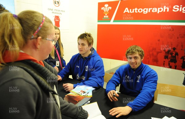 21.02.11 - Wales Rugby Training - Jonathan Davies and Leigh Halfpenny sign autographs at a Wales rugby training session which was opened up to the public at the Millennium Stadium. 