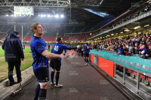21.02.11 - Wales Rugby Training - Bradley Davies and Morgan Stoddart throw signed rugby balls into the crowd at a Wales rugby training session which was opened up to the public at the Millennium Stadium. 