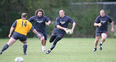 21.05.07  Wales rugby on Tour to Australia Gareth Thomas gets past Ceri Jones(14) with Adam Jones and Iestyn Thomas(rt) in support during training in Terrigal. 