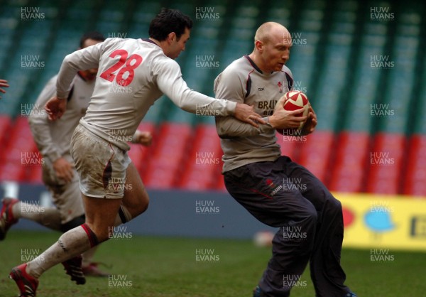 21.11.06 - Wales Rugby Training- Tom Shanklin(R) is caught by Stephen Jones during training 