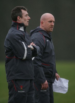 22.01.08 - Wales Rugby Training - Wales Defence Coach, Shaun Edwards and Backs coach, Rob Howley(r) look on during training 