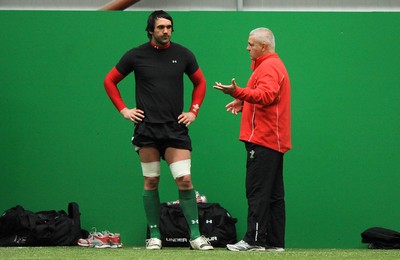 22.02.10 - Wales Rugby Training - Jonathan Thomas talks to wales head coach Warren Gatland during training. 