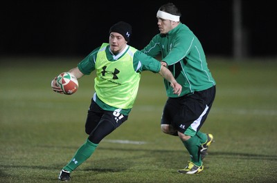22.02.10 - Wales Rugby Training - Richie Rees is tackled by Paul James during a night training session in preparation for Wales Friday night match with France. 