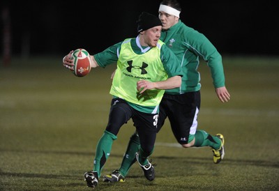 22.02.10 - Wales Rugby Training - Richie Rees is tackled by Paul James during a night training session in preparation for Wales Friday night match with France. 