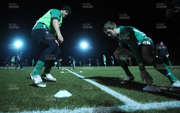 22.02.10 - Wales Rugby Training - Jamie Roberts and Andrew Bishop take part in a night training session in preparation for their teams Friday night match with France. 