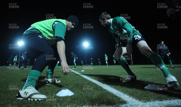 22.02.10 - Wales Rugby Training - Jamie Roberts and Andrew Bishop take part in a night training session in preparation for their teams Friday night match with France. 