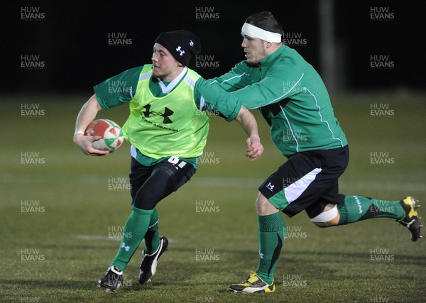 22.02.10 - Wales Rugby Training - Richie Rees is tackled by Paul James during a night training session in preparation for Wales Friday night match with France. 