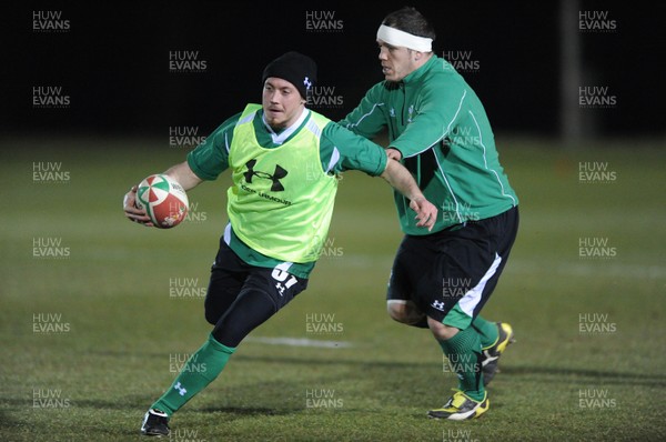 22.02.10 - Wales Rugby Training - Richie Rees is tackled by Paul James during a night training session in preparation for Wales Friday night match with France. 