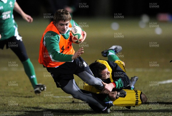 22.02.10 - Wales Rugby Training - Leigh Halfpenny is tackled by Sam Warburton during a night training session in preparation for Wales Friday night match with France. 