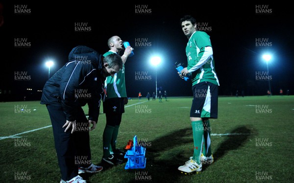 22.02.10 - Wales Rugby Training - Richie Rees(c) and Mike Phillips with backs coach Rob Howley during a night training session in preparation for Wales Friday night match with France. 