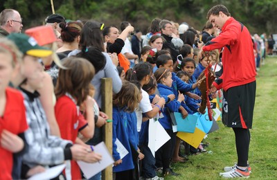 22.09.11 - Wales Rugby Training - George North talks children about the love spoon which is carried by the youngest member of the Wales squad. 