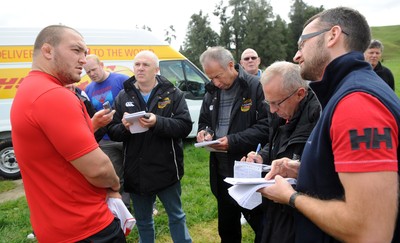 22.09.11 - Wales Rugby Training - Craig Mitchell talks to reporters during training. 