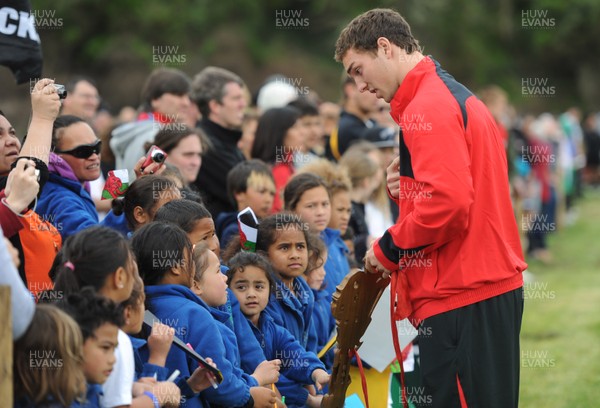 22.09.11 - Wales Rugby Training - George North talks children about the love spoon which is carried by the youngest member of the Wales squad. 