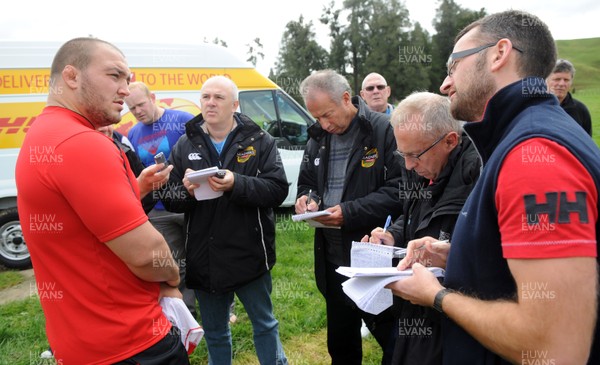 22.09.11 - Wales Rugby Training - Craig Mitchell talks to reporters during training. 