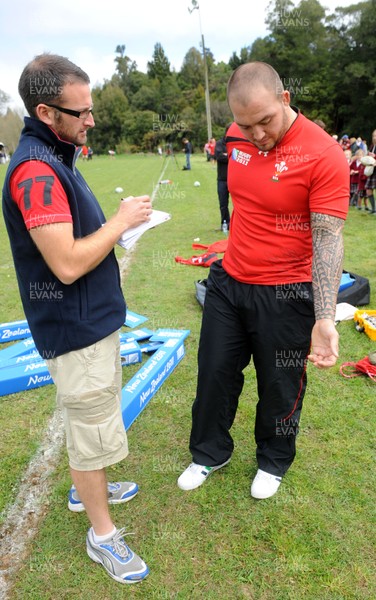 22.09.11 - Wales Rugby Training - Craig Mitchell talks to reporters during training. 