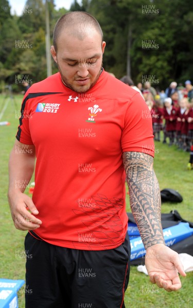 22.09.11 - Wales Rugby Training - Craig Mitchell talks to reporters during training. 