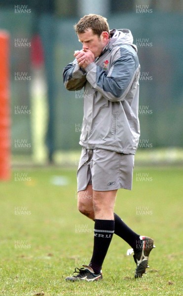 230205 - Wales Rugby Training - Wales' Kevin Morgan tries to fend off the cold during training today