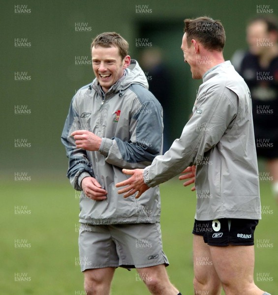 230205 - Wales Rugby Training - Wales' Kevin Morgan jokes with Mark Taylor during training today