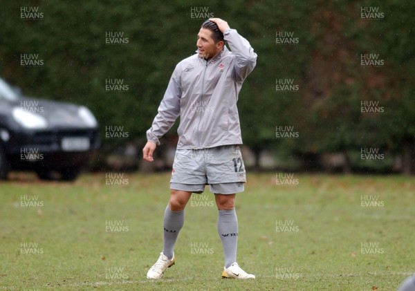 230206 - Wales Rugby Training - Gavin Henson holds his hair back 