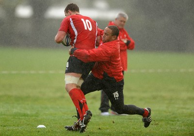 23.06.10 - Wales Rugby Training - Deiniol Jones is tackled by Gavin Thomas during training. 