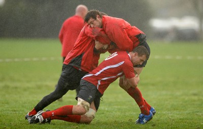 23.06.10 - Wales Rugby Training - Ryan Jones is tackled by Deiniol Jones and Gavin Thomas during training. 