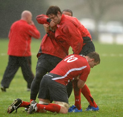 23.06.10 - Wales Rugby Training - Ryan Jones is tackled by Deiniol Jones and Gavin Thomas during training. 