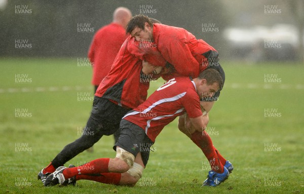 23.06.10 - Wales Rugby Training - Ryan Jones is tackled by Deiniol Jones and Gavin Thomas during training. 