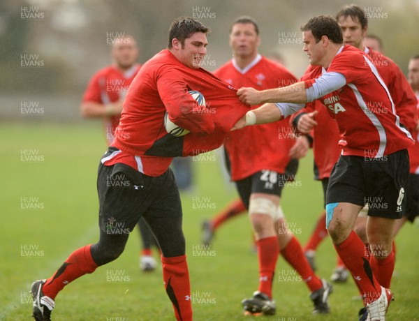 23.06.10 - Wales Rugby Training - Rob McCusker is tackled by Jamie Roberts during training. 