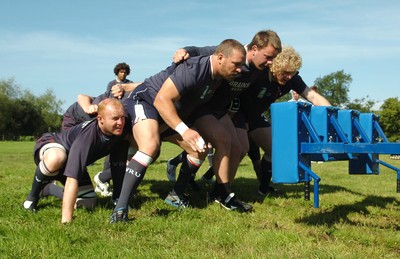 23.08.07 - Wales Rugby Training - (L-R)Martyn Williams, Chris Horsman, Matthew Rees and Duncan Jones go through their moves on the scrum machine during training 