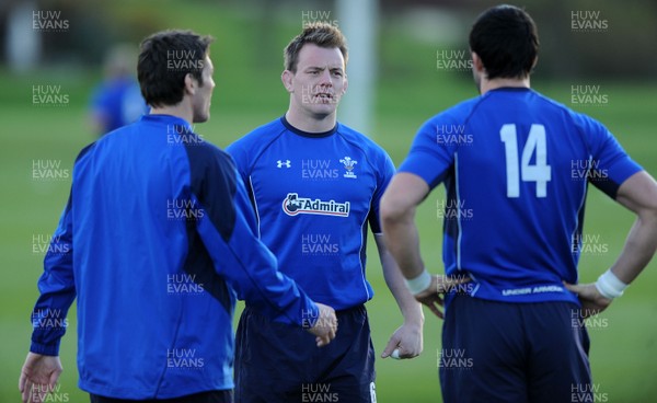 23.11.10 - Wales Rugby Training - Matthew Rees talks to James Hook(L) and Jonathan Thomas during training. 