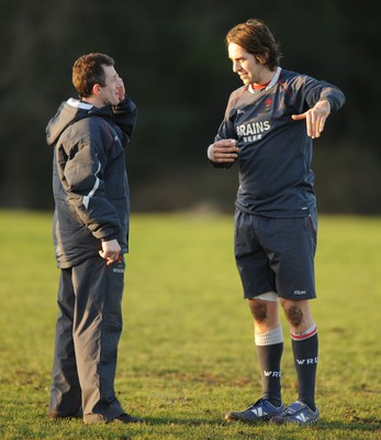 24.01.08 - Wales Rugby Training- Wales Backs coach, Rob Howley(L) talks to Captain, Ryan Jones during training 