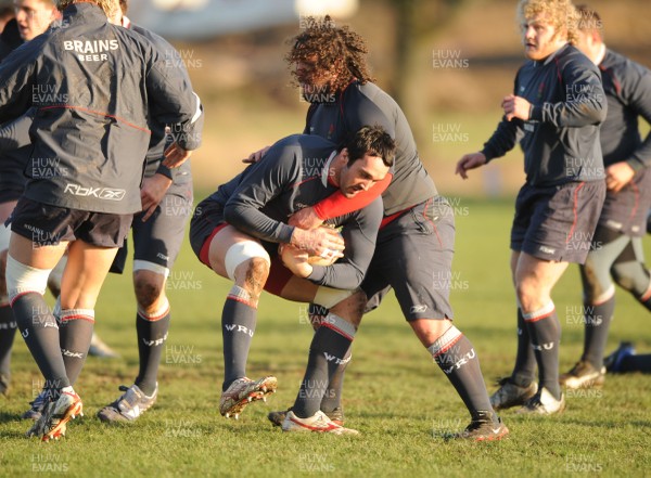 24.01.08 - Wales Rugby Training- Jonathan Thomas is tackled by Adam Jones during training 