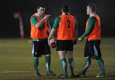 24.02.10 - Wales Rugby Training - Stephen Jones talks toHuw Bennett(c) and Paul James(r) during a night training session in preparation for Wales Friday night match against France. 